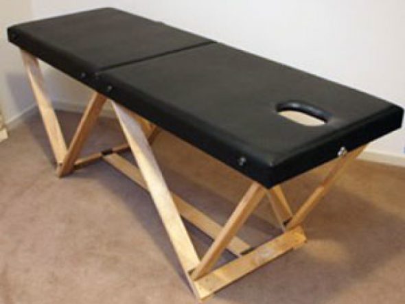Svart vikande massagebord