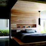 Snyggt design sovrum med en bädd-podium