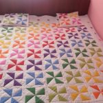 Multicolored Pinwheels on Quilt