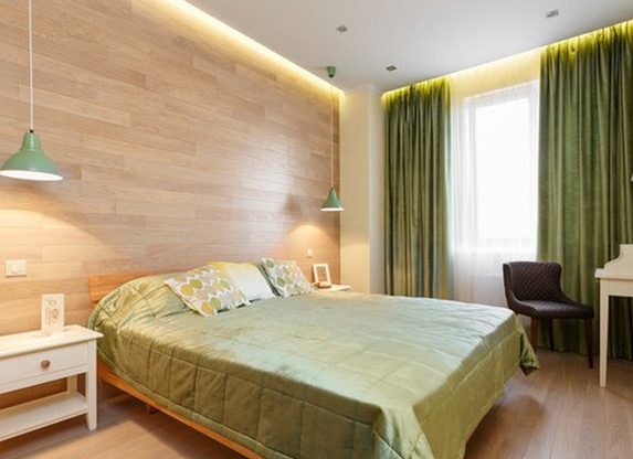 Gezellige slaapkamer met olijftextiel