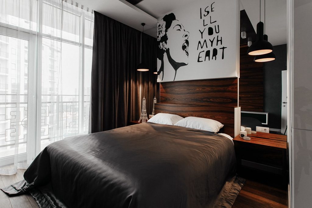 Zwarte kleur in het ontwerp van een slaapkamer voor een man.