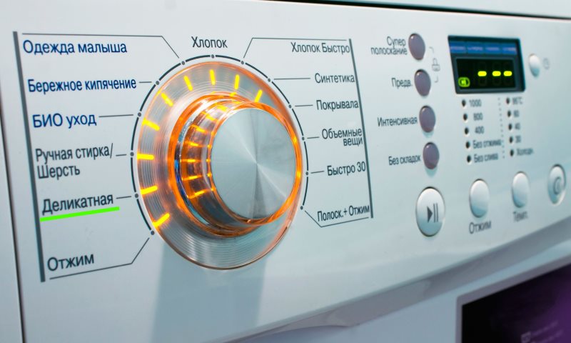 Het handvat van de keuze van de wijze van wassen in de automatische machine