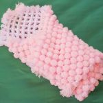 zacht roze plaid van pompons